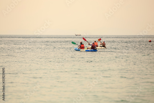 People are paddling a happy kayaking in the sea In Krabi Province, Thailand