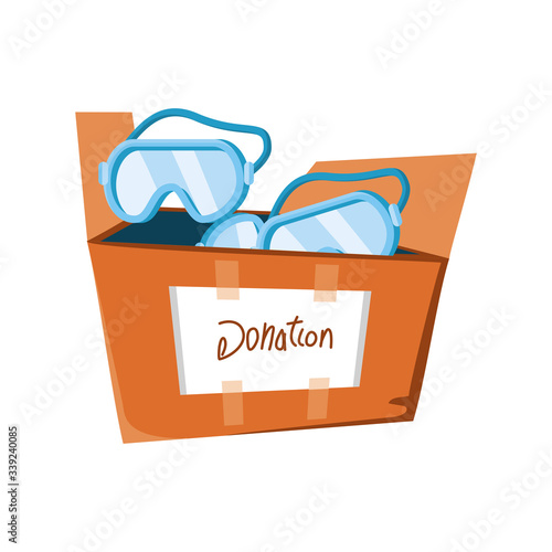 cardboard box with protective glasses on white background