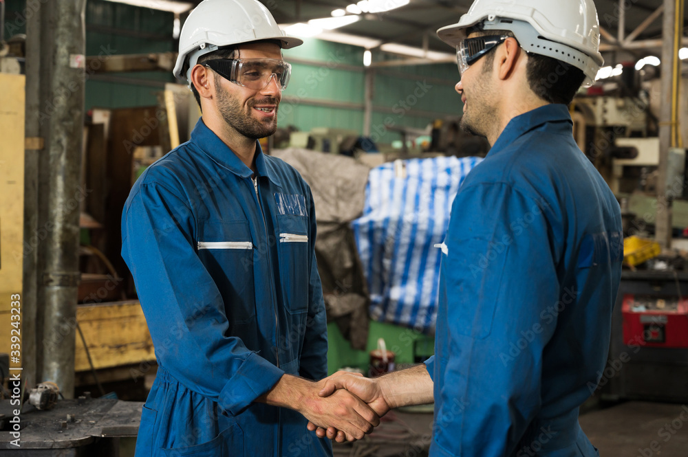 Industrial workers are working on projects in large industrial plants with many devices. Industrial workers are working on projects in large industrial plants with many devices.