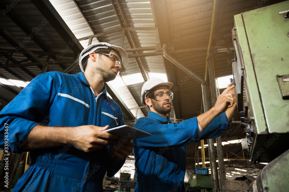 Industrial workers are working on projects in large industrial plants with many devices. Industrial workers are working on projects in large industrial plants with many devices.