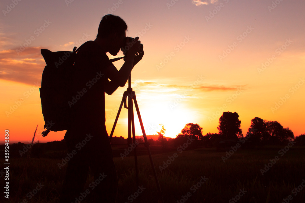 silhouette of photography with a sunset setting