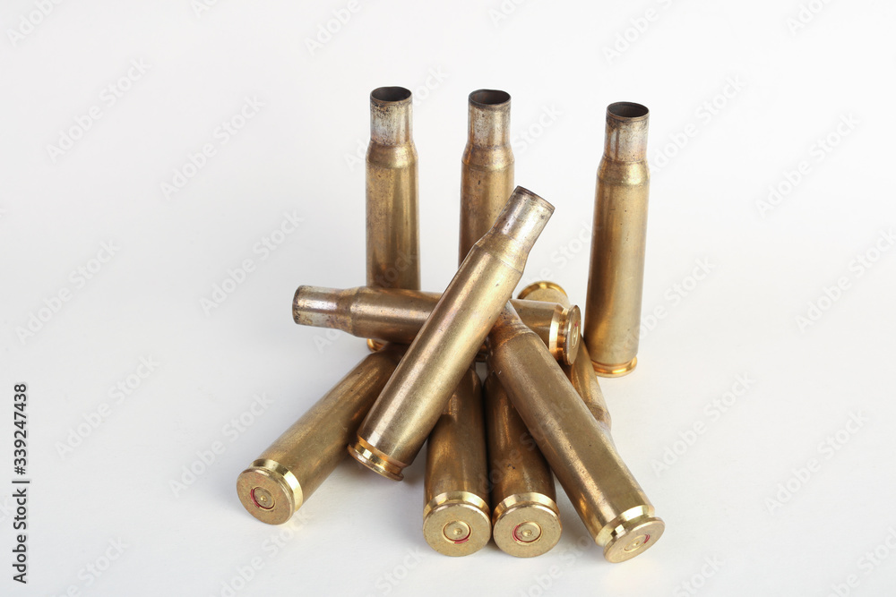 rifle bullet shell casings on white background rifle bullet shell casings on white background