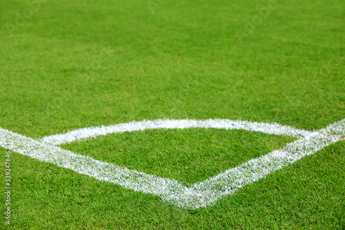 conner line on green grass of football field