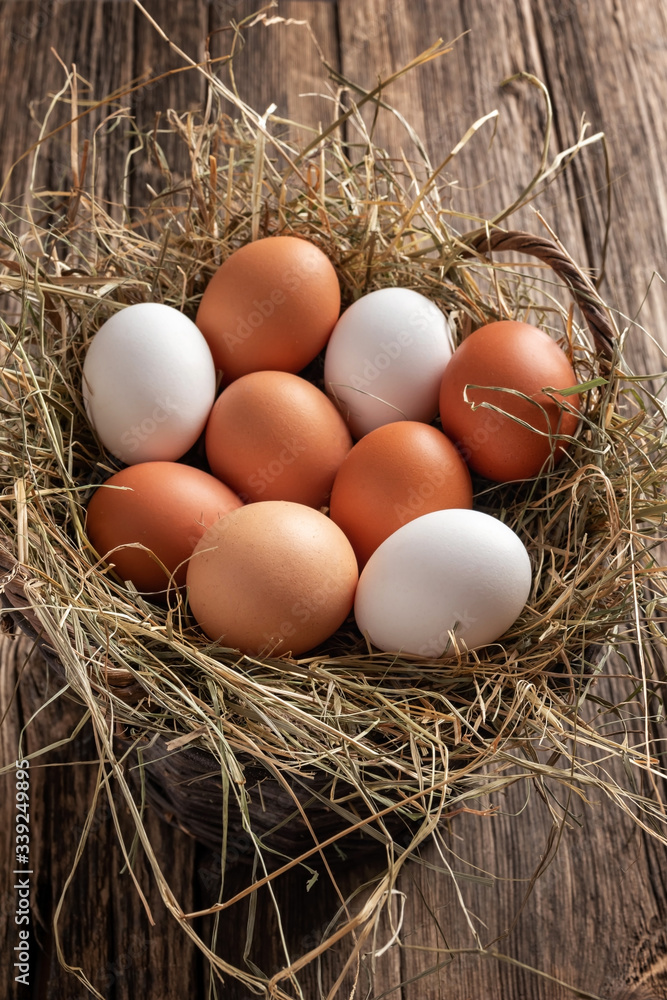 Raw hen eggs in a basket Raw hen eggs in a basket