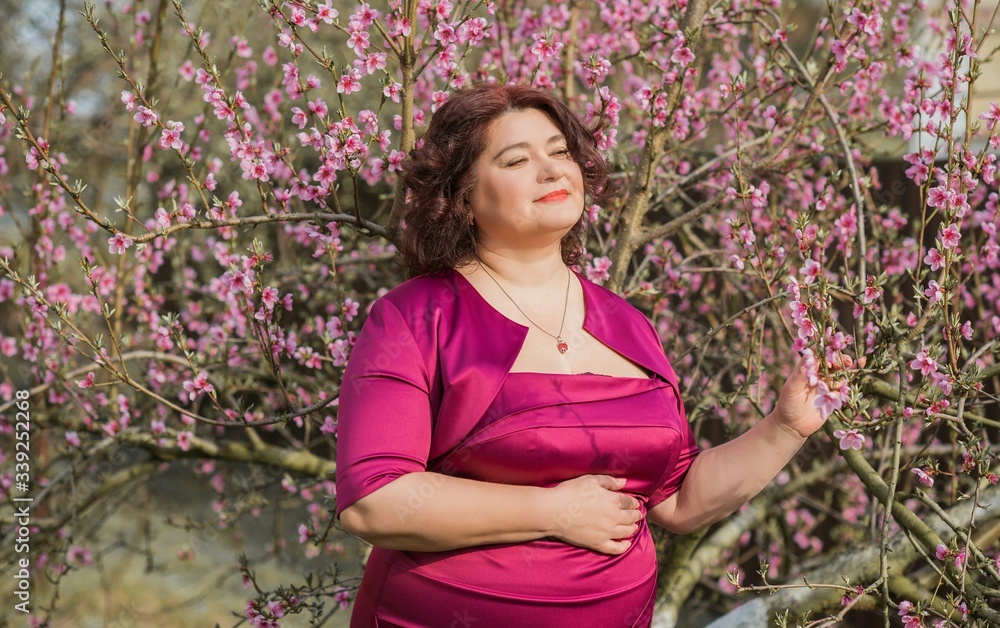 Middle age plus size woman enjoying the life. A mature lady with excess weight, stylishly dressed. Natural beauty