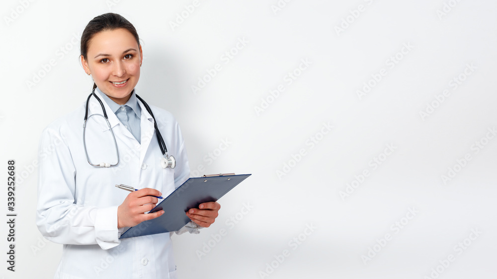 portrait of a female medical worker. Young doctor with clipboard on white. for copyspace portrait of a female medical worker. Young doctor with clipboard on white. for copyspace