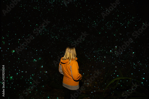 Tourist girl at  Glowworm Cave, New Zealand  photo