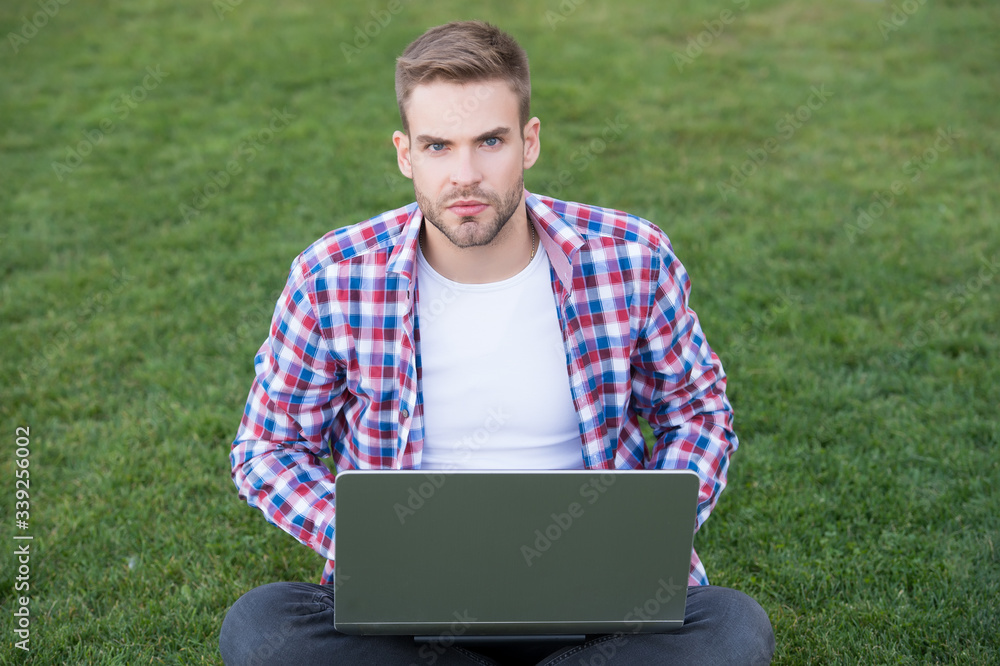 Laptop that is right to blog. Young blogger use laptop on green grass. Handsome man with laptop computer outdoors. Notebook and pc. Laptop technology. Modern life. Internet surfing. Start blogging Laptop that is right to blog. Young blogger use laptop on green grass. Handsome man with laptop computer outdoors. Notebook and pc. Laptop technology. Modern life. Internet surfing. Start blogging