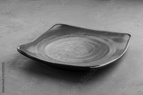 Grey square plate under the concrete for placing products.