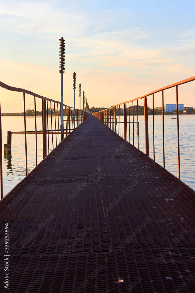 Iron footbridge over the lake