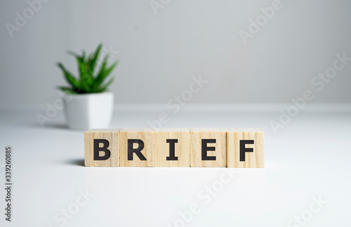brief word on the wooden cubes in table. photo