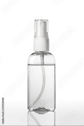 Instant antiseptic hand sanitizer mist spray, antibacterial alcohol liquid. One transparent plastic bottle with atomizer pump isolated on white background, studio shot. Mini travel pocket small size.