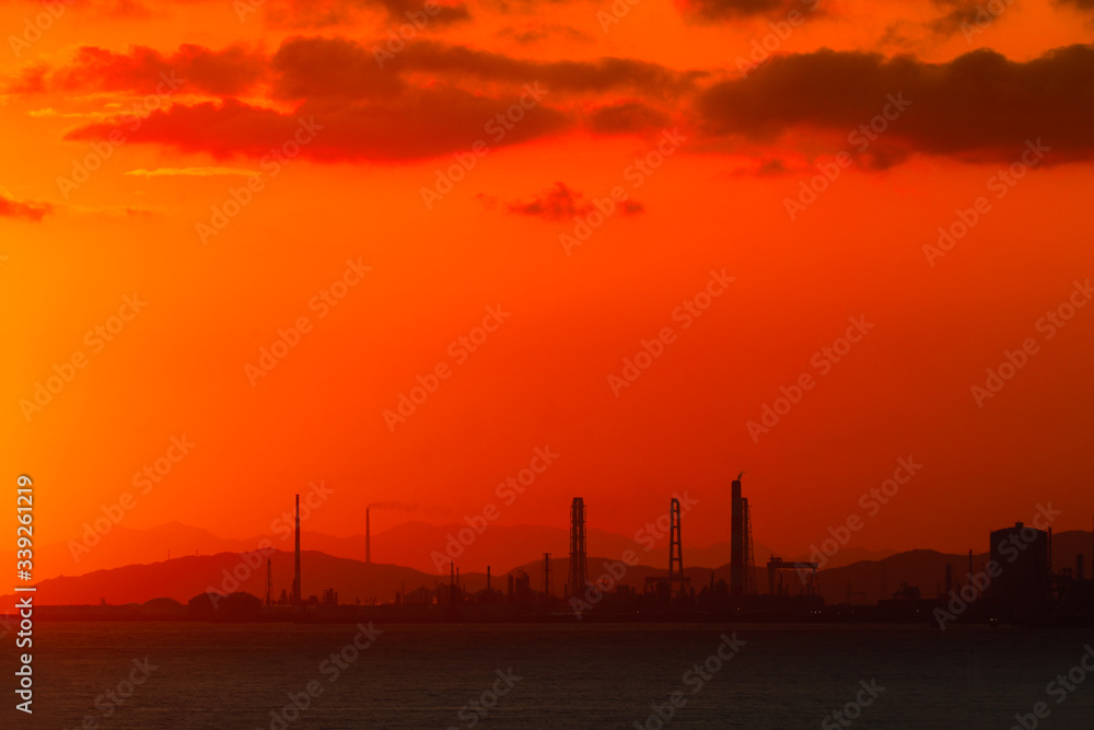 sunrise on sea beach at industrial city in Japan sunrise on sea beach at industrial city in Japan
