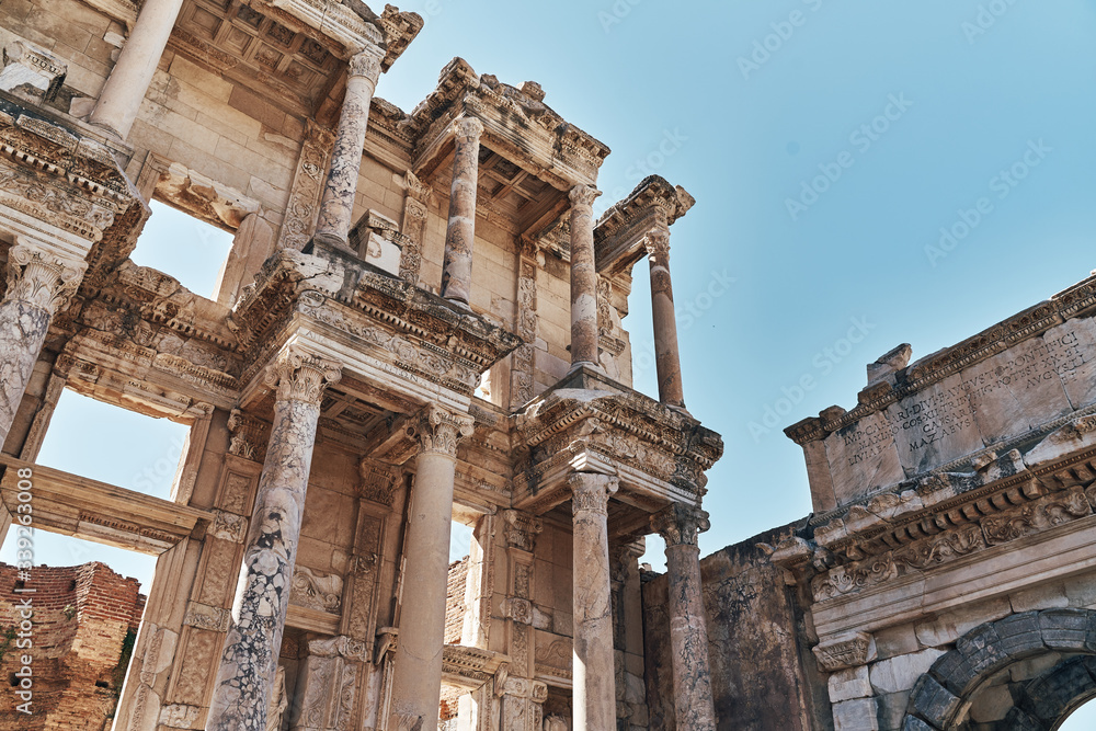 The ruins of Celsus Library in Ephesus at sunny evening sun. Beautiful light of the old ancient rocks and stones, turkey