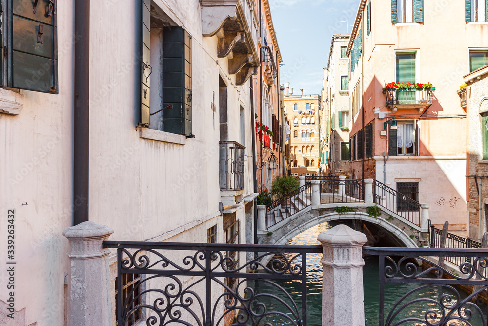 Fototapeta premium Bridges over a narrow canal in the old town of Venice, Italy