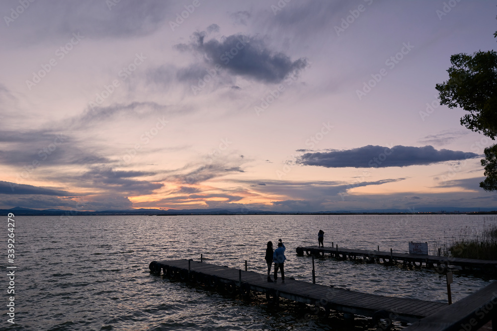 Jetty on a lake a stormy day, sunset Jetty on a lake a stormy day, sunset