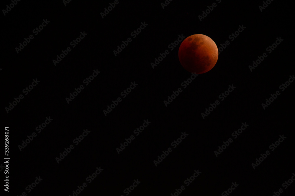 The moon that is covered by the shadow of the world is dark red The moon that is covered by the shadow of the world is dark red