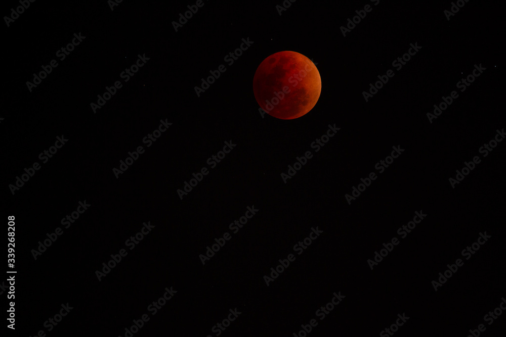 The moon that is covered by the shadow of the world is dark red The moon that is covered by the shadow of the world is dark red