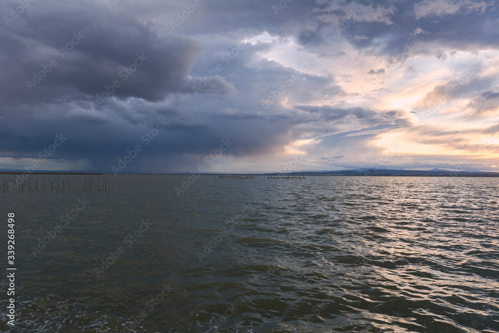 Landscape of a lake with storm clouds
