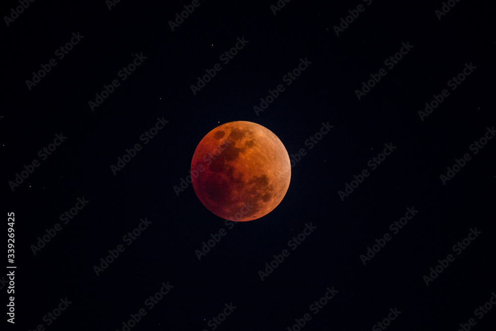 The moon that is covered by the shadow of the world is dark red