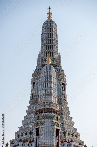 Wat Arun temple in a blue sky. Wat Arun is a Buddhist temple in Bangkok, Thailand. photo