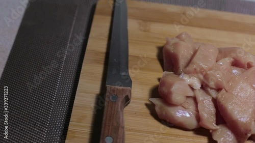 raw chicken meat on a cutting board, cooking at home