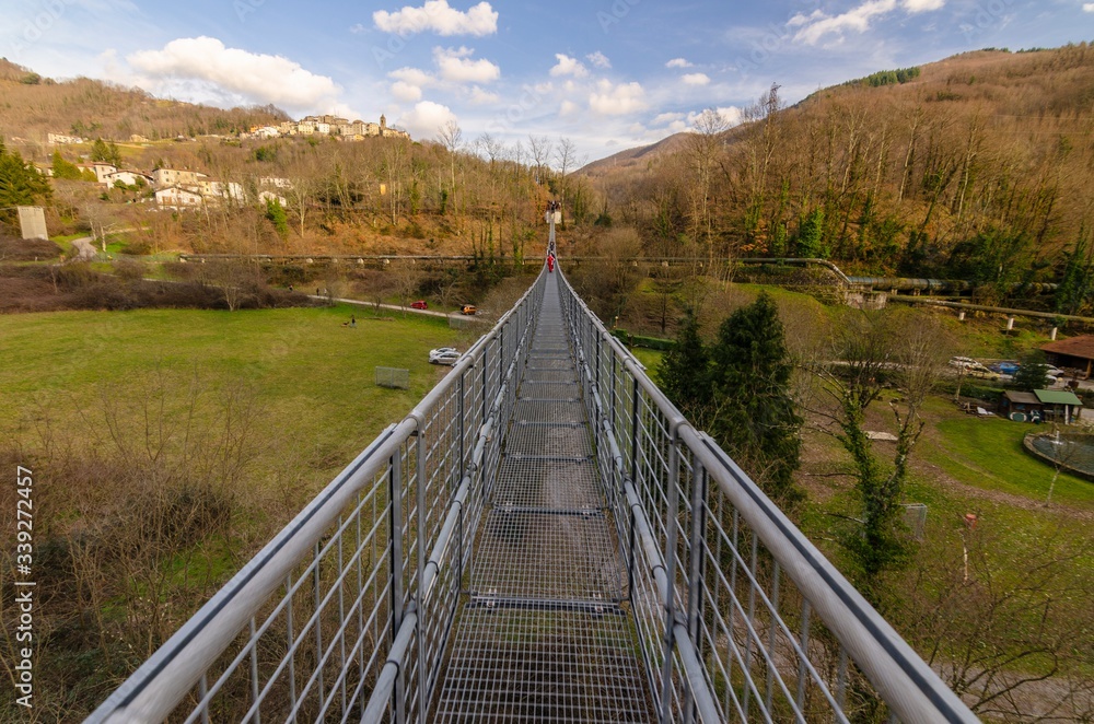 Suspension bridge walkway seen from above in the foreground