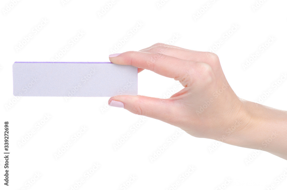 Fototapeta premium Nail file sanding buff in hand on a white background isolation
