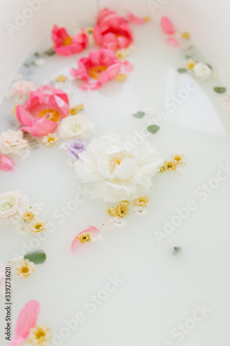 Fresh flowers in the bathroom. Health and beauty. © Marina