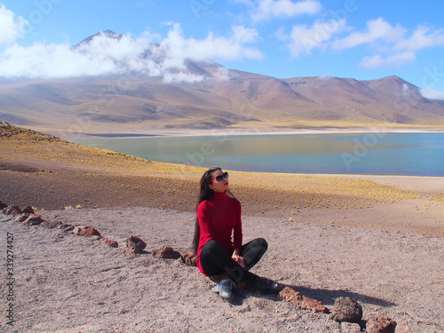 Girl near Altiplano lagoon in the Atacama Desert, San Pedro de Atacama, Chile