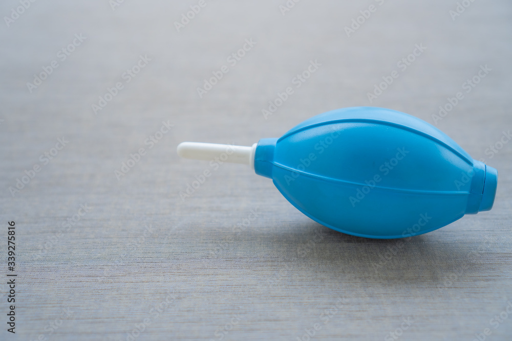 Hand Air Blower on background. Used to clean electronic and camera from dust. Rubber Air Blower Pump Dust Cleaner for Camera. Equipment for cleaning camera. Hand Air Blower on background. Used to clean electronic and camera from dust. Rubber Air Blower Pump Dust Cleaner for Camera. Equipment for cleaning camera.