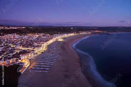 View at the end of the day over the town and beach of Nazaré