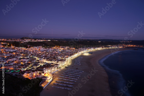 View at the end of the day over the town and beach of Nazaré