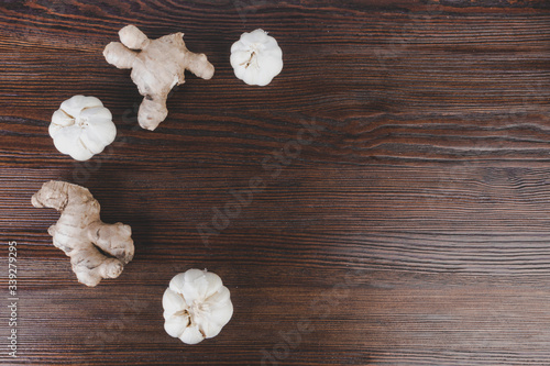 ginger and garlic on wooden background