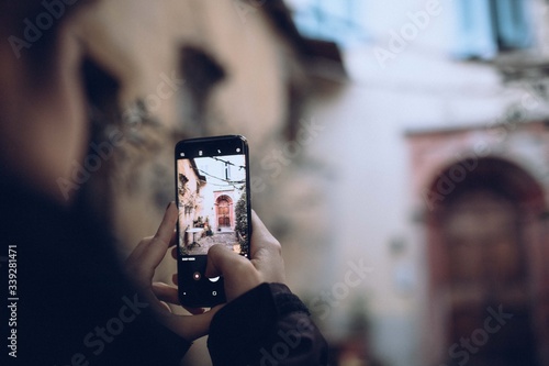 young woman taking picture on her phone