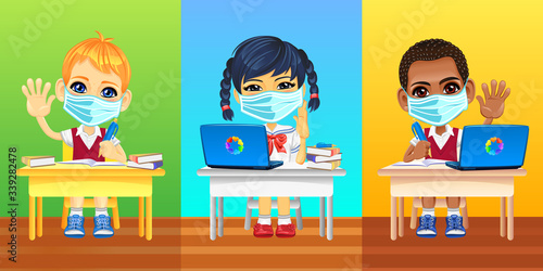 European, asian and african schoolkids in protective masks and school uniforms sitting at school desk during coronavirus COVID-19 quarantine
