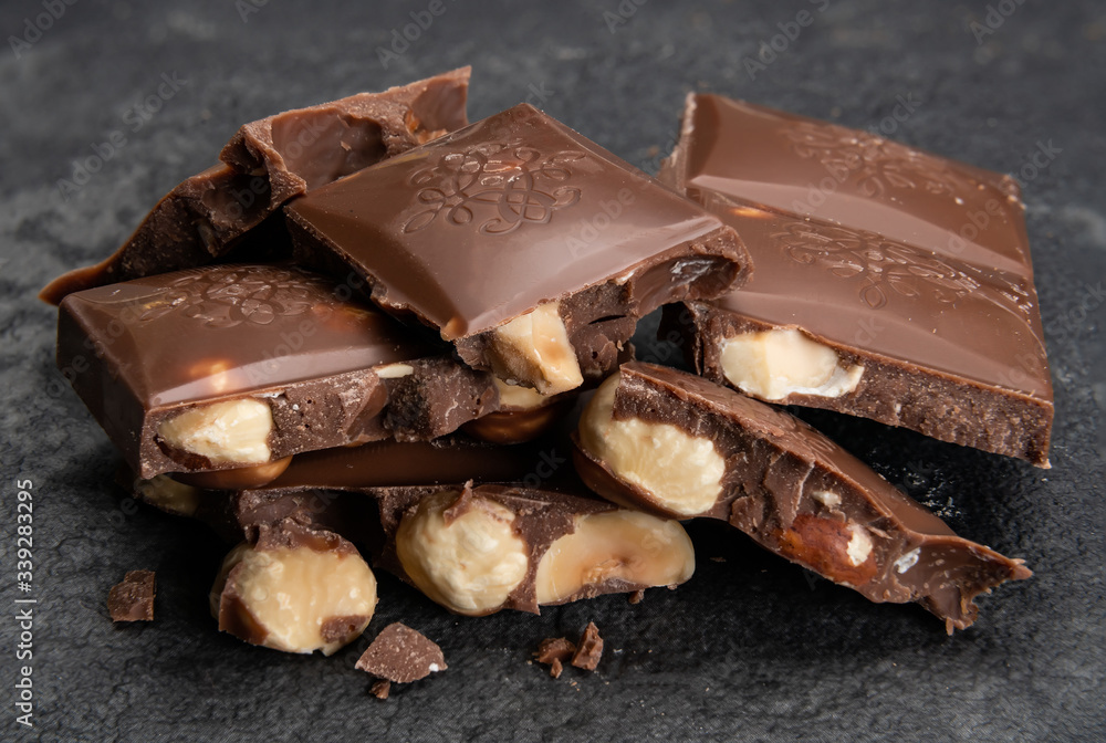pieces of chocolate with nuts closeup pieces of chocolate with nuts closeup