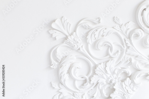 Beautiful ornate white decorative plaster moldings in studio.