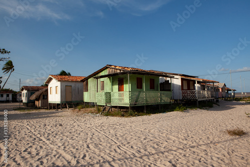 colorful beach huts in amazon brazil © alexandre