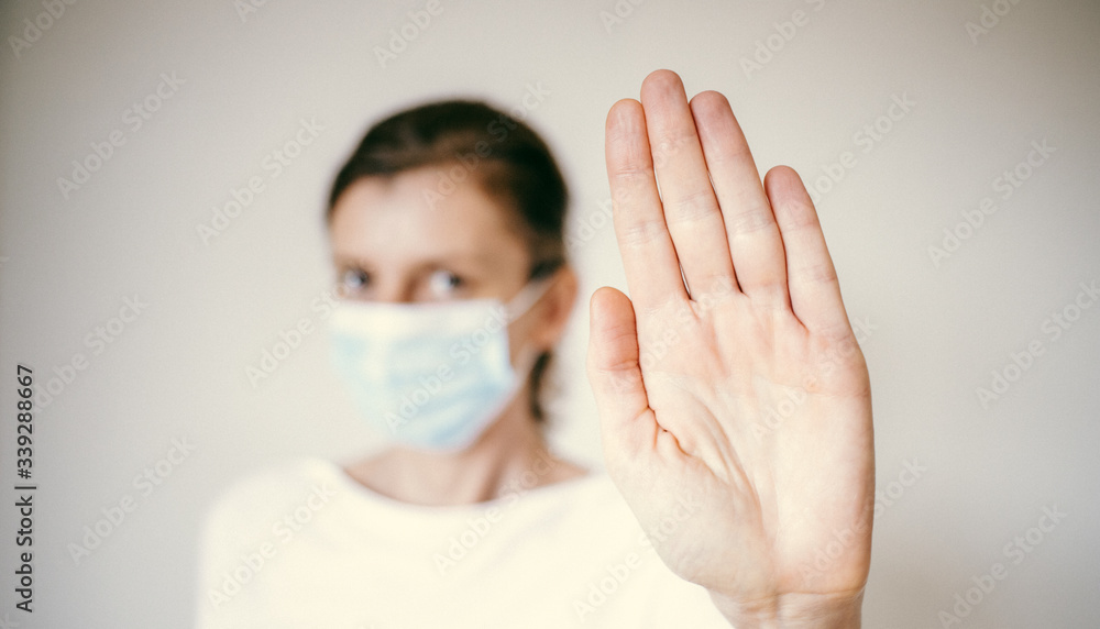 stop coronavirus woman wearing medical mask and raising hand 2019-nCoV fight - spreading