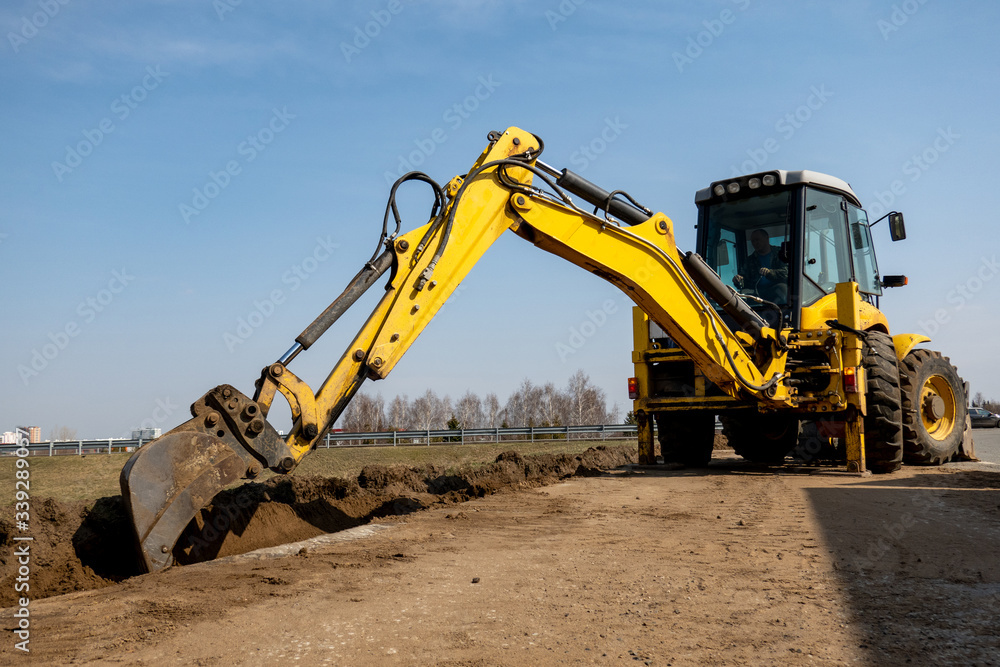 Road repairs. Expansion of the roadbed. The excavator removes the soil. Road repairs. Expansion of the roadbed. The excavator removes the soil.