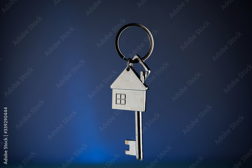 A close up of a key on blue background A close up of a key on blue background