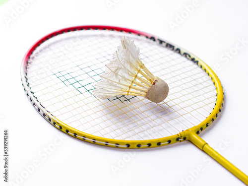 Badminton racket and White Feather Shuttlecock with a  colour white background stock isolated image.  © sdx15