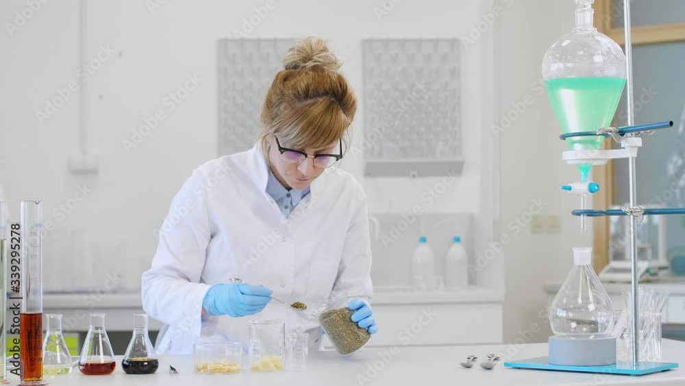 Chemist working with hemp CBD oil in laboratory Chemist working with hemp CBD oil in laboratory