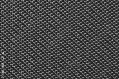 Wattled black fabric texture background. Close up. Top view.
