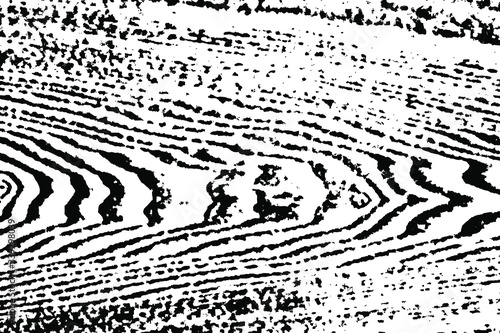 Grunge texture of the wood surface, unevenly erased. Abstract rough background with noise, dirt and spots. Vector illustration. Overlay template.