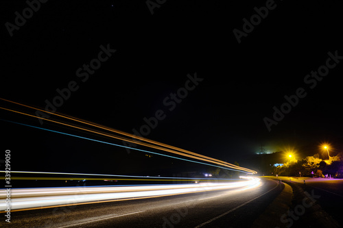Light trails of cars at motorway in the night long exposure