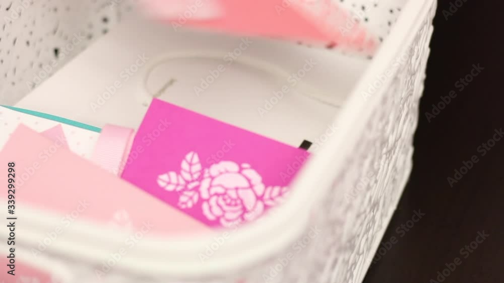 A man chooses greeting cards from a box. Close-up shot. A man chooses greeting cards from a box. Close-up shot.