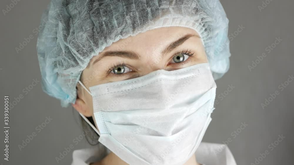 Portrait of a female doctor or nurse wearing medical face mask Portrait of a female doctor or nurse wearing medical face mask