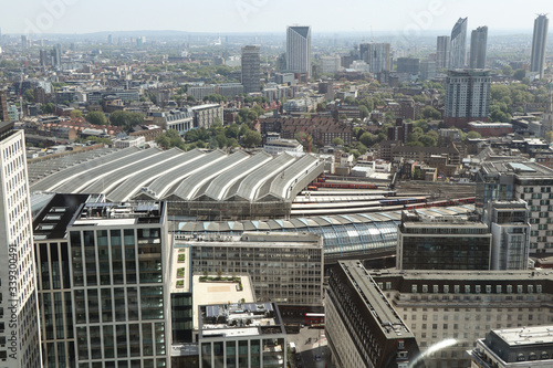 London cityscape with many dominants. In foreground see London waterloo station and behin him Waterloo Millennium Green park. Historical town with modern buildings. Pride of United kingdom